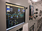 Digital control panel displaying a Caterpillar power system’s electrical monitoring interface.