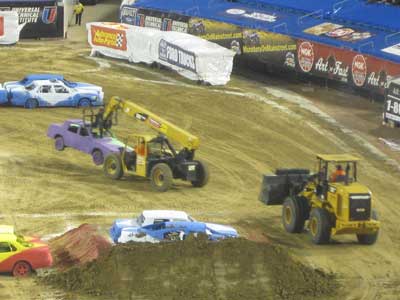 CAT Telehandler moves car during Monster Jam CAT Telehandler moves car during Monster Jam
