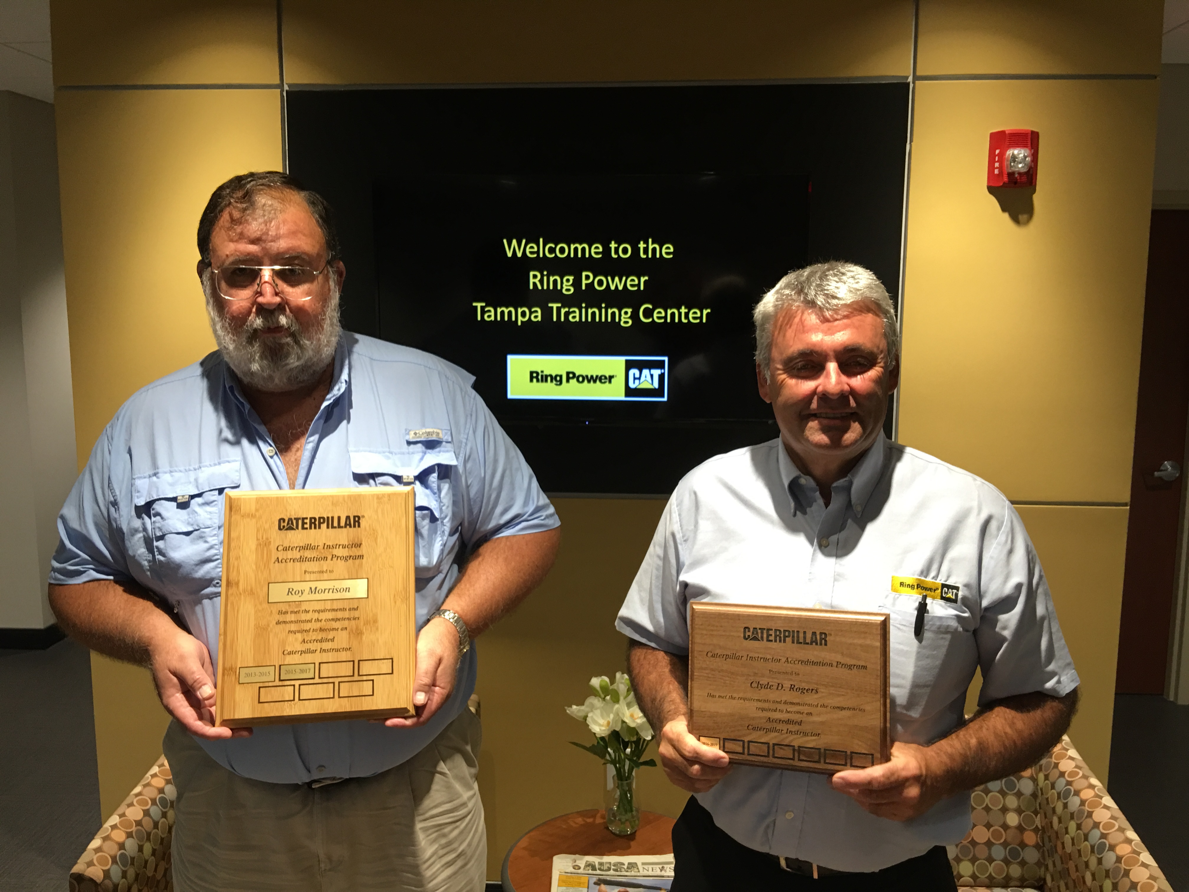 Roy Morrison (left) and Clyde Rogers with their CIAP Certification plaques