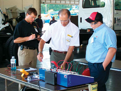 Ring Power Training Instructor Bob Delp explains the electrical fundamentals test objectives to SkillsUSA competitor. Ring Power Training Instructor Bob Delp explains the electrical fundamentals test objectives to SkillsUSA competitor.